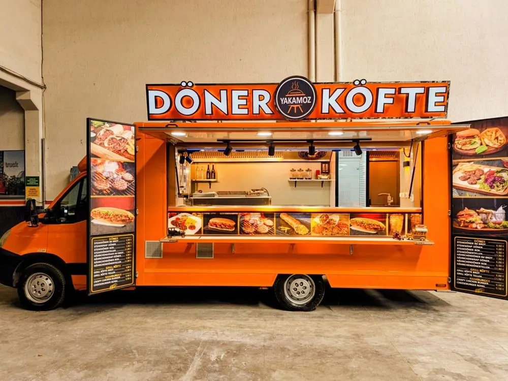 Orange döner and köfte food truck with a full-length serving hatch