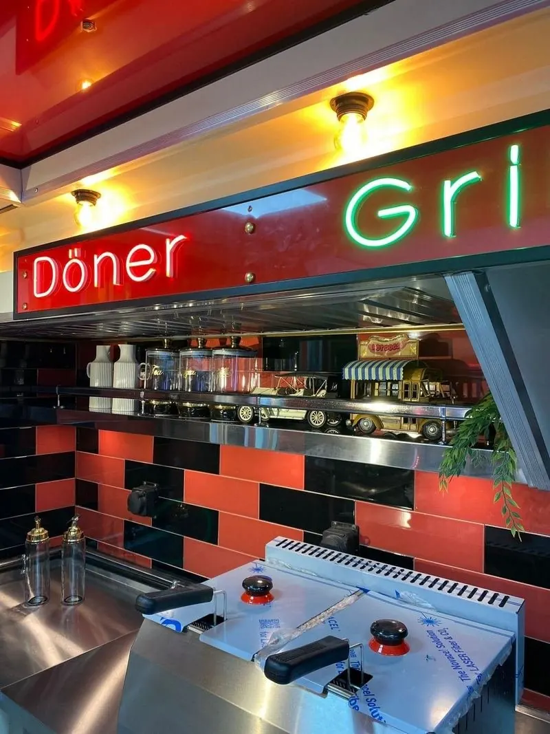 Neon sign and stainless fit-out inside a vintage food truck