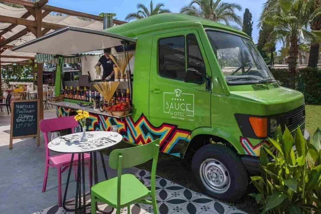 Green Sauce Hotel food truck with its awning open